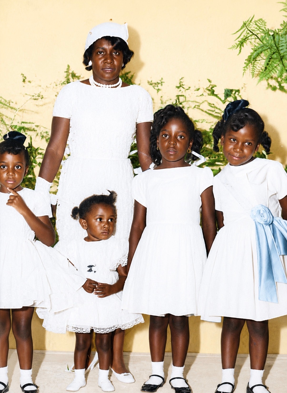 Beautifully colorized portrait of mother and children after restoration