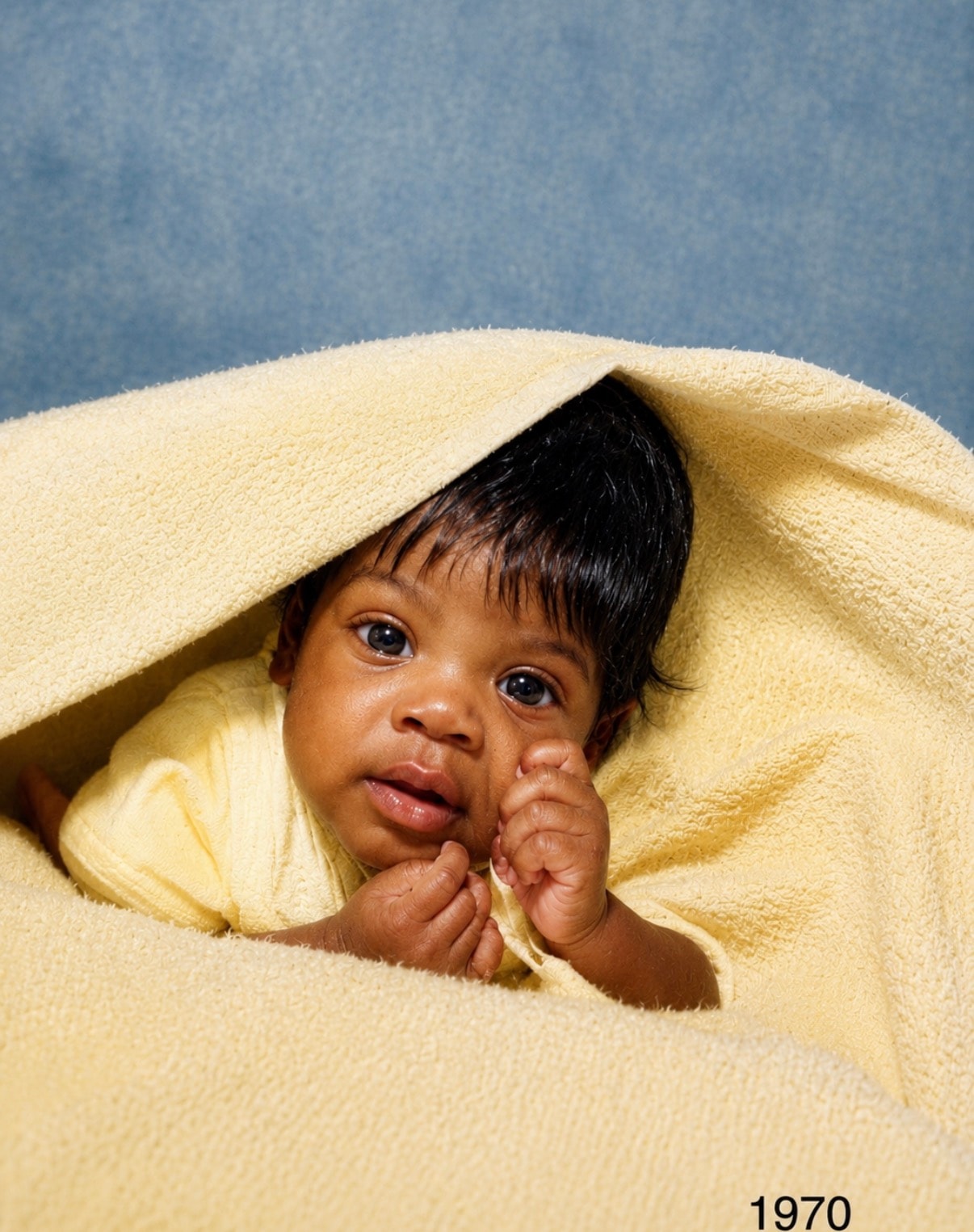 Colorized 1970 baby portrait with warm natural tones
