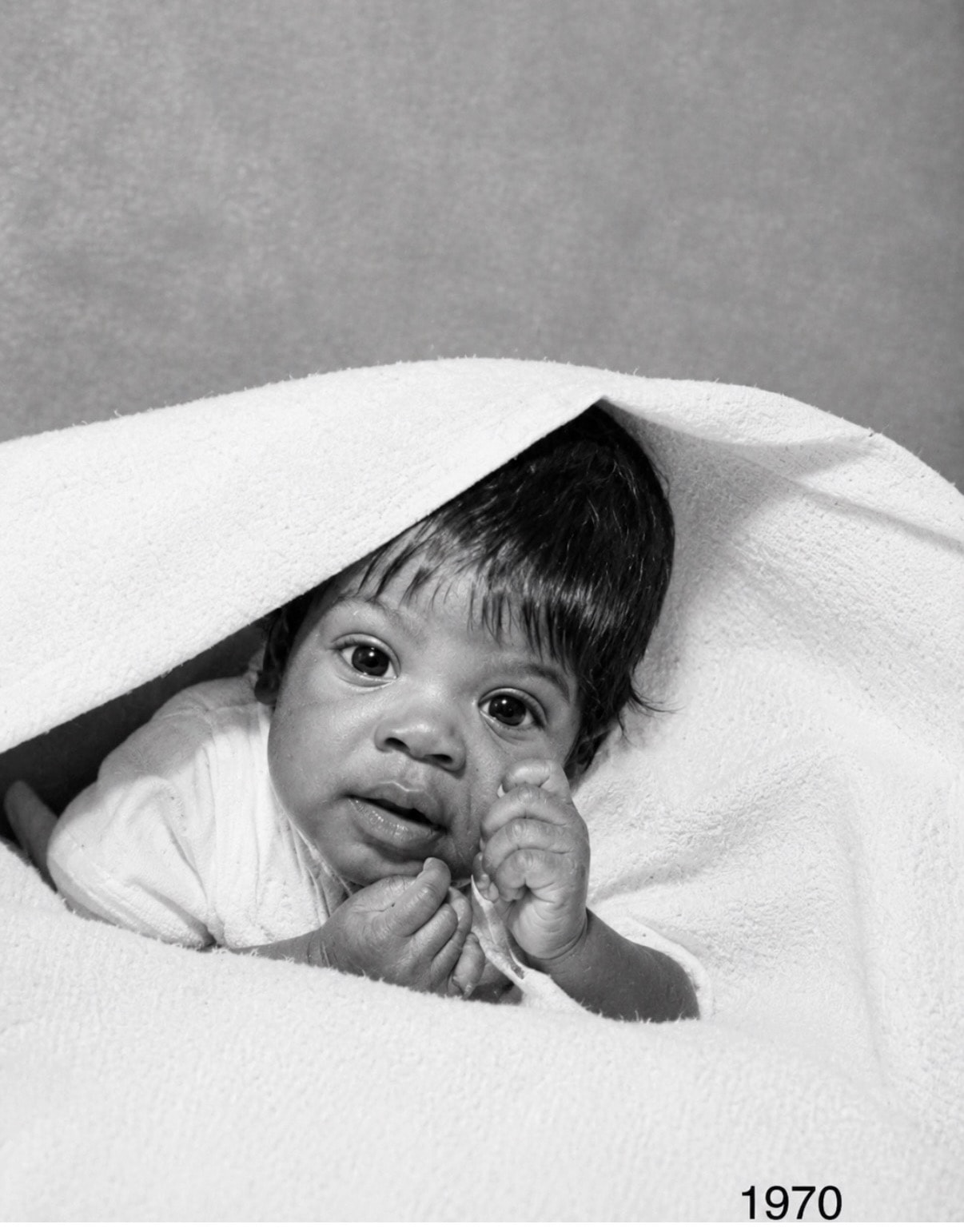 Black and white 1970 baby portrait before colorization